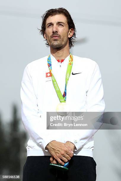 Gold medalist Fabian Cancellara of Switzerland celebrates on the podium at the medal ceremony for the Cycling Road Men's Individual Time Trial on Day...