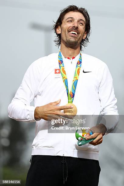 Gold medalist Fabian Cancellara of Switzerland celebrates on the podium at the medal ceremony for the Cycling Road Men's Individual Time Trial on Day...