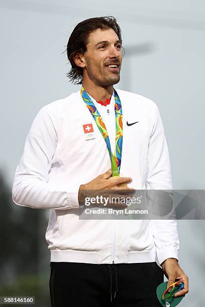 Gold medalist Fabian Cancellara of Switzerland celebrates on the podium at the medal ceremony for the Cycling Road Men's Individual Time Trial on Day...