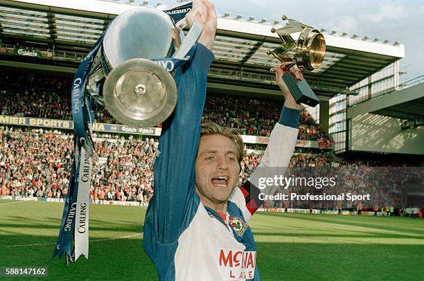 Blackburn Rovers captain Tim Sherwood celebrating with the FA Premier League Championship trophy following their match against Liverpool at Anfield,...