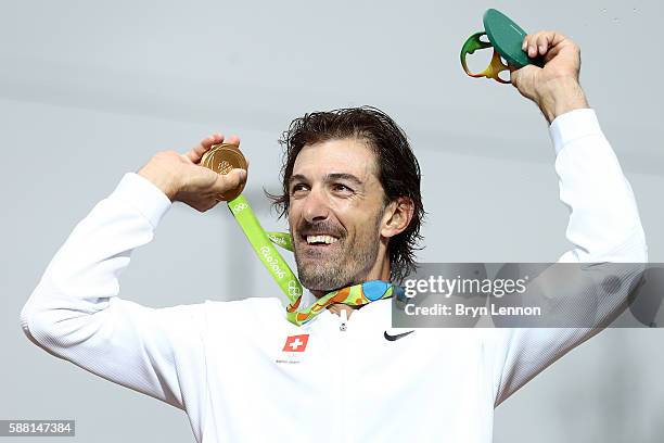 Gold medalist Fabian Cancellara of Switzerland celebrates on the podium at the medal ceremony for the Cycling Road Men's Individual Time Trial on Day...