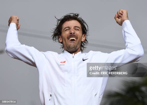 Gold medallist Switzerland's Fabian Cancellara celebrates on the podium after the Men's Individual Time Trial event at the Rio 2016 Olympic Games in...