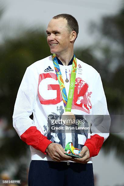 Bronze medalist Christopher Froome of Great Britain celebrates on the podium at the medal ceremony for the Cycling Road Men's Individual Time Trial...