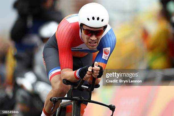 Tom Dumoulin of the Netherlands crosses the finish line in the Cycling Road Men's Individual Time Trial on Day 5 of the Rio 2016 Olympic Games at...