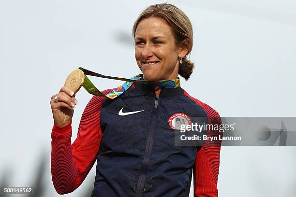 Gold medalist Kristin Armstrong of the United States celebrates on the podium at the medal ceremony for the Cycling Road Women's Individual Time...