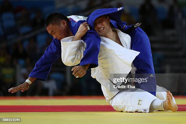 Otgonbaatar Lkhagvasuren of Mongolia competes against Varlam Liparteliani of Georgia during a Men's -90kg Quarterfinal bout on Day 5 of the Rio 2016...