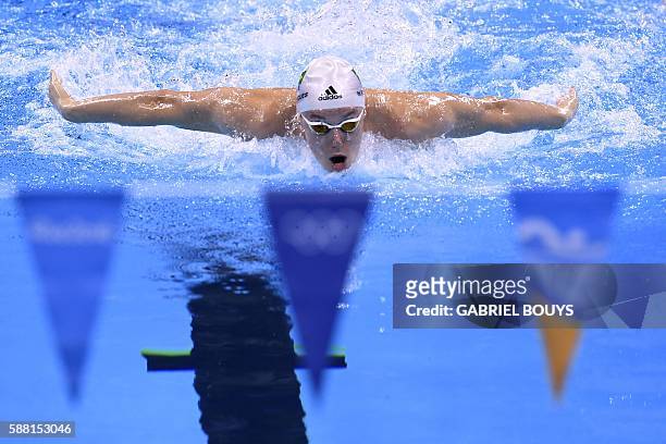 Brazil's Henrique Rodrigues competes in a Men's 200m Individual Medley heat during the swimming event at the Rio 2016 Olympic Games at the Olympic...