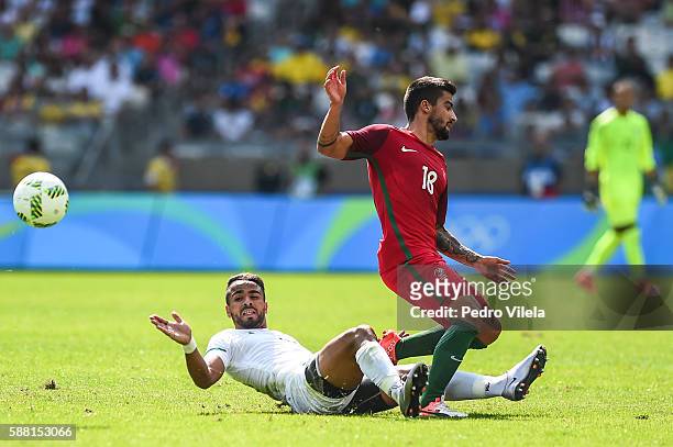 Tiago Silva of Portugal and Houari Ferhani of Algeria battle for the ball during the Men's Group D match between Algeria and Portugal on Day 5 of the...