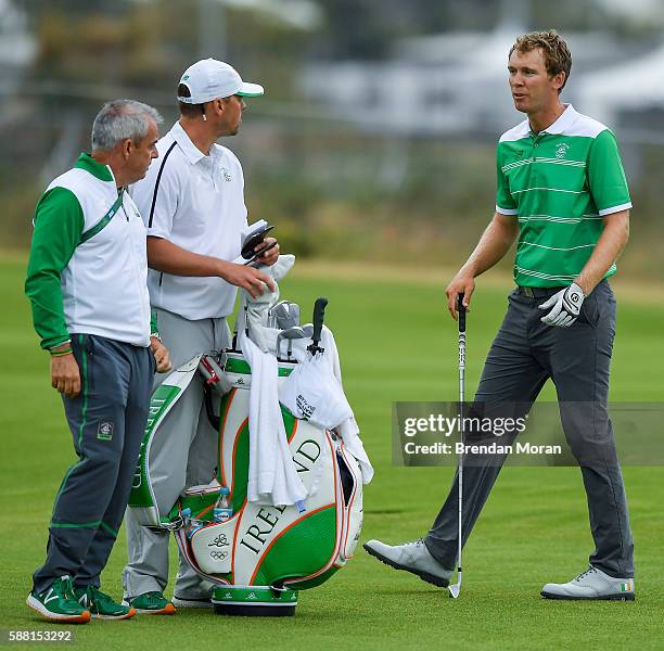 Rio , Brazil - 10 August 2016; Seamus Power, right, of Ireland with his caddy John Rathouz and Team Ireland golf captain Paul McGinley during a...