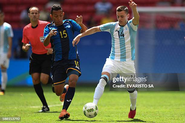 Argentina's player Giovanni Lo Celso vies for the ball with Honduras midfield Allan Banegas during the Rio 2016 Olympic Games first Round Group D...