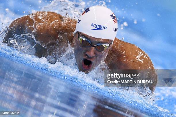 S Ryan Lochte competes in a Men's 200m Individual Medley heat during the swimming event at the Rio 2016 Olympic Games at the Olympic Aquatics Stadium...