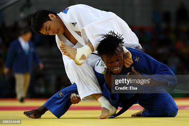 Donghan Gwak of Korea competes against Popole Misenga of the Refugee Olympic Team during a Men's -90kg bout on Day 5 of the Rio 2016 Olympic Games at...