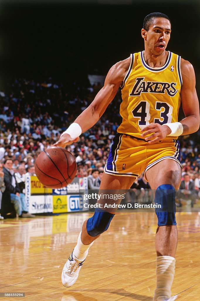 Mychal Thompson of the Los Angeles Lakers dribbe the ball during a