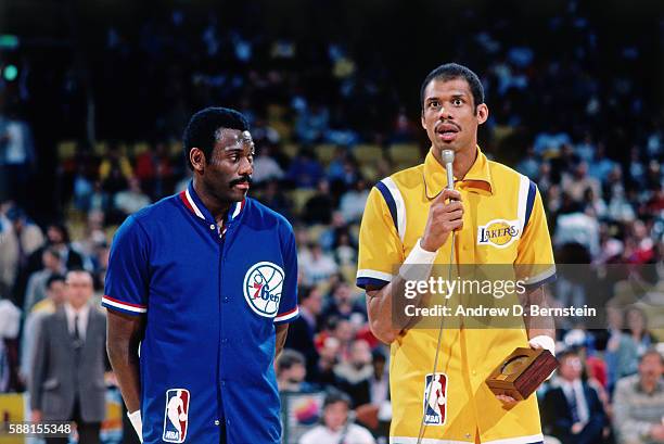 Bob McAdoo and Kareem Abdul-Jabbar of the Los Angeles Lakers speak during the 1985 ring ceremony circa 1985 at The Forum in Los Angeles, California....