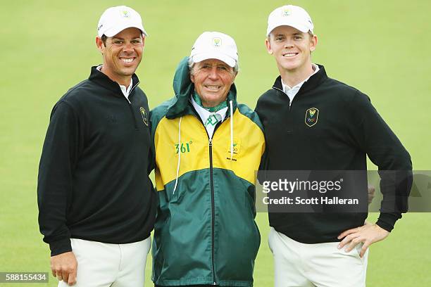 Jaco van Zyl and Brandon Stone of South Africa pose with team leader Gary Player during a practice round on Day 4 of the Rio 2016 Olympic Games at...