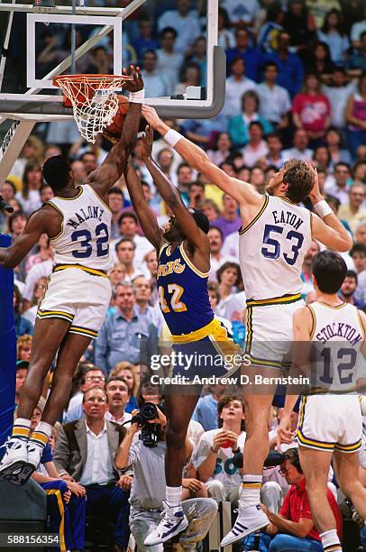 Karl Malone of the Utah Jazz blocks the shot of James Worthy of the Los Angeles Lakers during a game in the Western Conference Semifinals circa 1988...