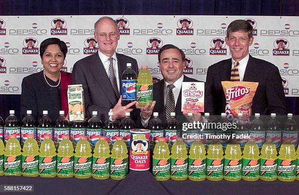 PepsiCo Inc. Has agreed to acquire the Quaker Oats Company. L-R: Pres. And CFO Indra Nooyi, Quaker Chairman and CEO Robert Morrison, Vice Chairman...