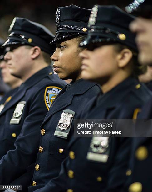 The New York Police Department graduation ceremony for 1,171 new recruits, held at Madison Square Garden. This graduating class of police recruits is...