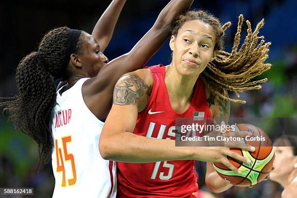 Basketball - Olympics: Day 3 Brittney Griner of United States drives past Astou Ndour Gueye of Spain during the USA Vs Spain Women's Basketball...