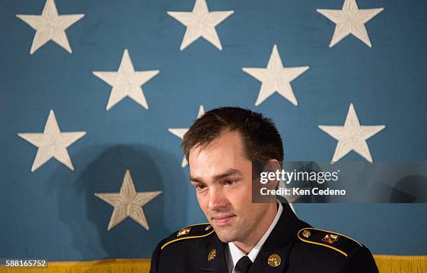 President Barack Obama awards Clinton Romesha, a former active duty Army Staff Sergeant, the Medal of Honor for conspicuous gallantry in the East...