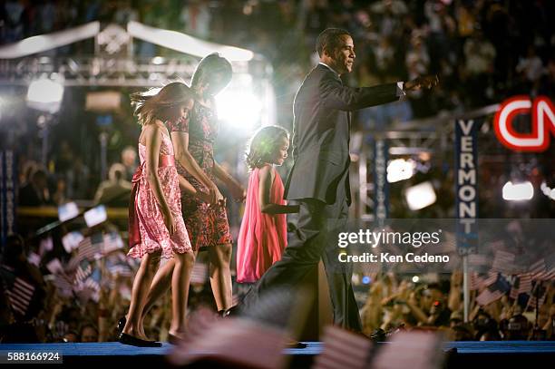 Democratic presidential canddiate Senator Barack Obama his wife Michelle and daughters Malia and Sasha, appear together on stage, after Obama's...