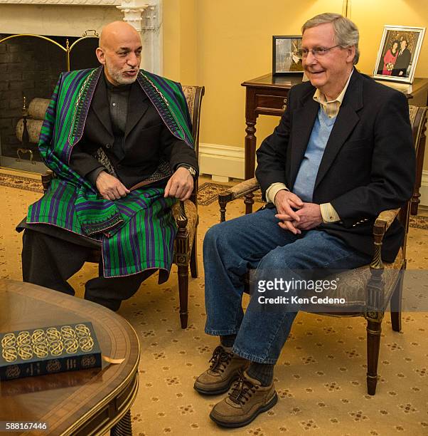 President of Afghanistan Hamid Karzai, left, meets with U.S. Senator Mitch McConnell , right, along with Sen. Bob Casey , Sen. Deb Fischer , and Sen....