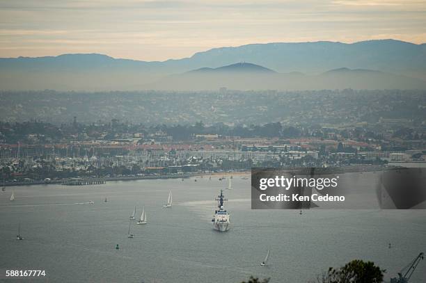 As seen from high above in Point Loma, a Coast Guard ship departs the Coast Guard Station based in San Diego Bay February 2, 2013. Photo Ken Cedeno