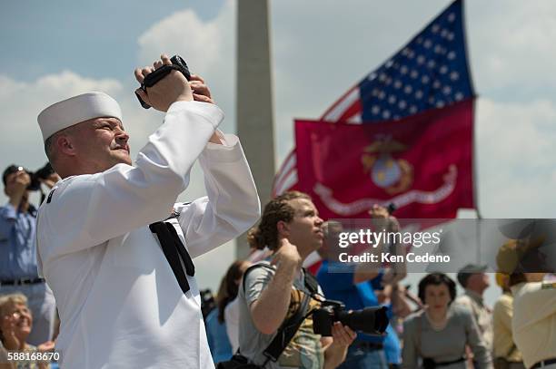 Navy Petty Officer Kevin Smith based in Baltimore, MD takes pictures of the most diverse array of World War II aircraft ever assembled performing a...