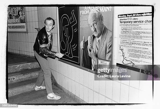 American artist Keith Haring drawing on a subway platform in New York City, circa 1982.