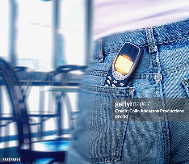 mobile phone in back pocket - phone in back pocket stock pictures, royalty-free photos & images
