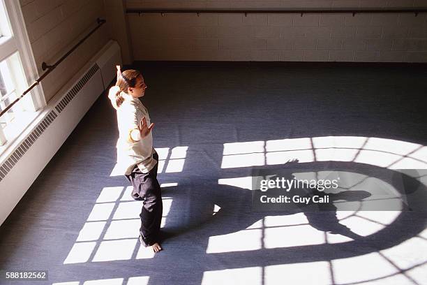 instructor practicing tai chi - tai chi shadow stock pictures, royalty-free photos & images