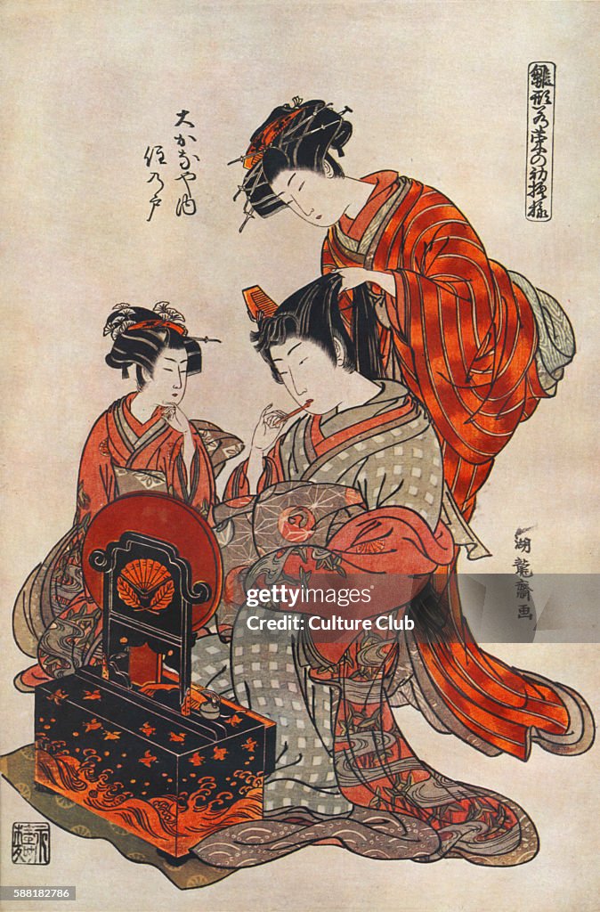 Courtesan in kimono being groomed by her
