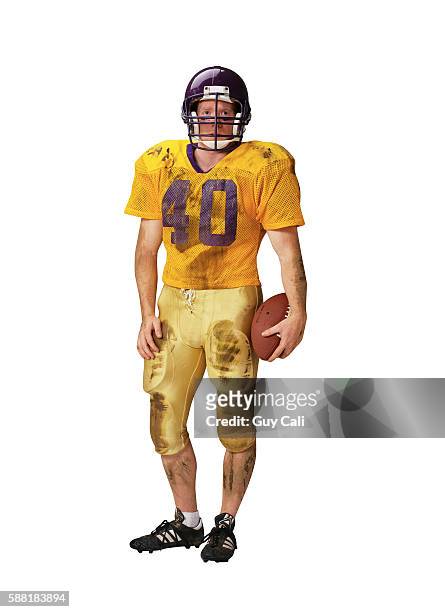 football player holding ball - american football uniform stock pictures, royalty-free photos & images