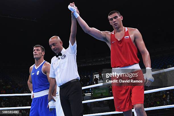 Evgeny Tishchenko of Russia celebrates defeating Clemente Russo of Italy in the Men's Heavy quarterfinals round fight on Day 5 of the Rio 2016...