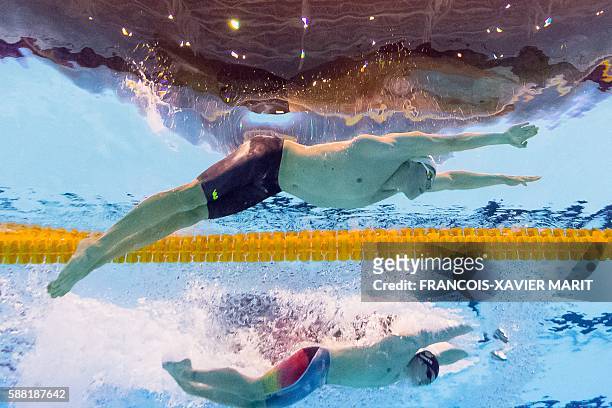 S Ryan Lochte and Brazil's Henrique Rodrigues compete in a Men's 200m Individual Medley heat during the swimming event at the Rio 2016 Olympic Games...