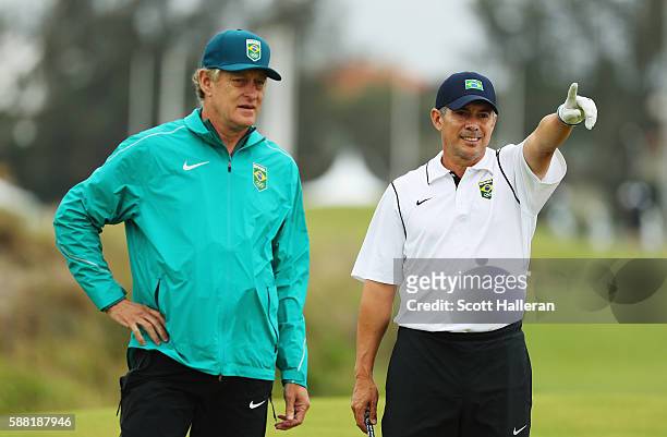 Adilson da Silva of Brazil waits in a fairway alongside his caddie during a practice round on Day 4 of the Rio 2016 Olympic Games at Olympic Golf...