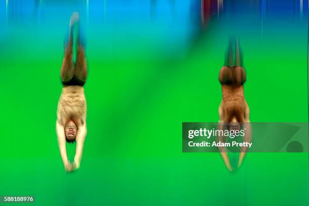 Sam Dorman and Mike Hixon of the United States compete in the Men's Diving Synchronised 3m Springboard Final on Day 5 of the Rio 2016 Olympic Games...