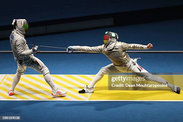Matyas Szabo of Germany and Pancho Paskov of Bulgaria compete during the men's individual sabre on Day 5 of the Rio 2016 Olympic Games at Carioca...