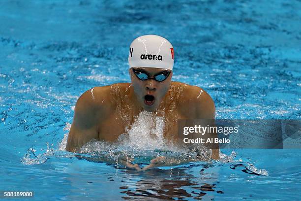Yixuan Hu of China competes in the Men's 200m Individual Medley heat on Day 5 of the Rio 2016 Olympic Games at the Olympic Aquatics Stadium on August...