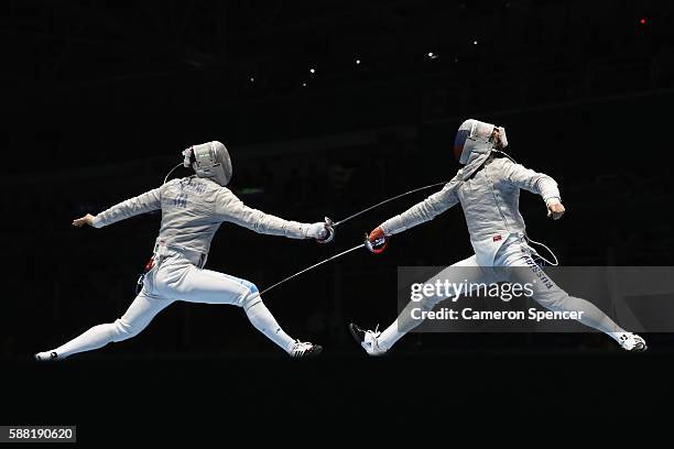 Nikolay Kovalev of Russia and Aldo Montano of Italy compete during the men's individual sabre on Day 5 of the Rio 2016 Olympic Games at Carioca Arena...