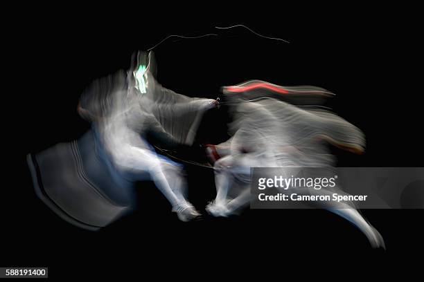 Nikolay Kovalev of Russia and Aldo Montano of Italy compete during the men's individual sabre on Day 5 of the Rio 2016 Olympic Games at Carioca Arena...