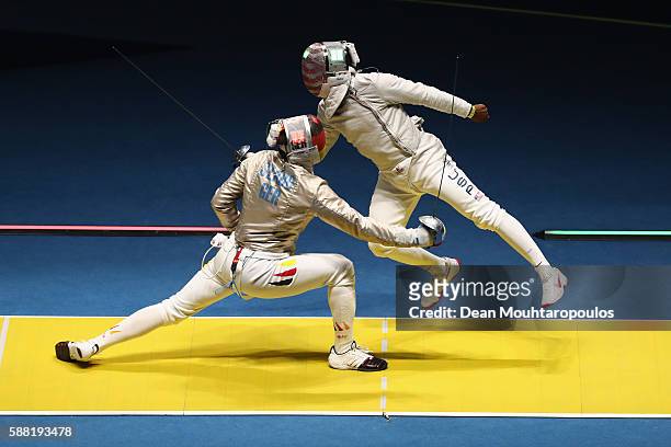 Daryl Homer of the United States and Matyas Szabo of Germany compete during the men's individual sabre quarterfinal on Day 5 of the Rio 2016 Olympic...