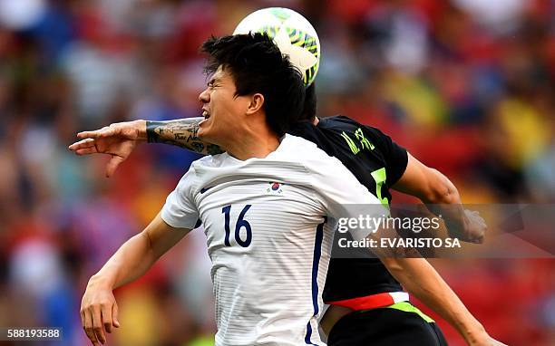 Republic of Korea's player Kwon Changhoon vies for the ball with Mexico's player Michael Perez during the Rio 2016 Olympic Games first Round Group C...