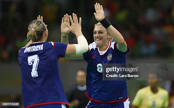 Anna Sen of Russia celebrates with Daria Dmitrieva of Russia during the Womens Preliminary Group B match between Russia and Sweden at Future Arena on...