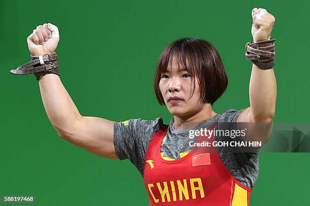 China's Xiang Yanmei reacts after she won the Women's 69kg weightlifting competition at the Rio 2016 Olympic Games in Rio de Janeiro on August 10,...