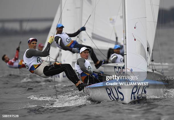 Russia's Pavel Sozykin and Russia's Denis Gribanov compete in the 470 Men sailing class on Marina da Gloria in Rio de Janerio during the Rio 2016...