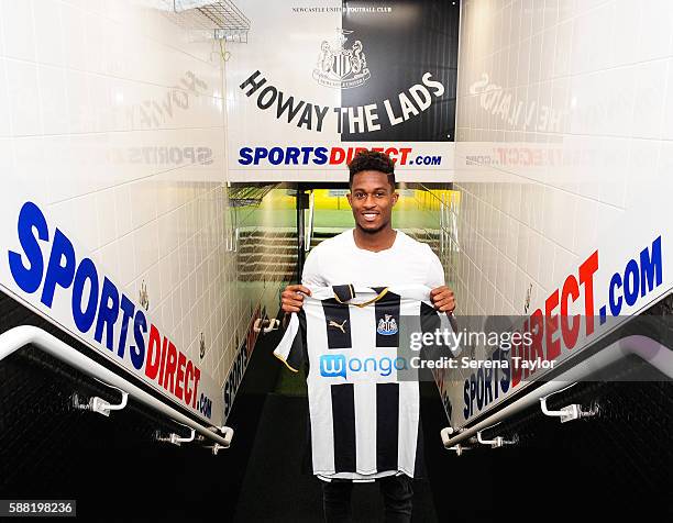 Rolando Aarons poses for photographs in the tunnel holding a club home shirt after signing a new 5 year contract for Newcastle United at St.James...