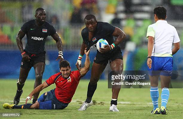 Willie Ambaka of Kenya is tackled by Francisco Hernandez of Spain in action during the Men's Placing 9-12, Match 20 between Spain and Kenya on Day 5...