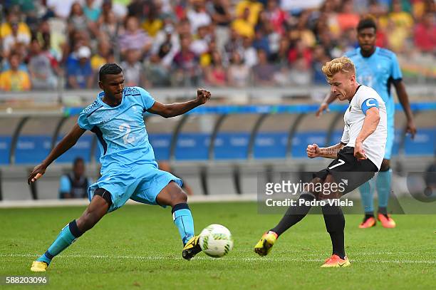 Maximilian Meyer of Germany shoots the ball past Praneel Naidu of Fiji during the Men's First Round Football Group C match between Germany and Fiji...