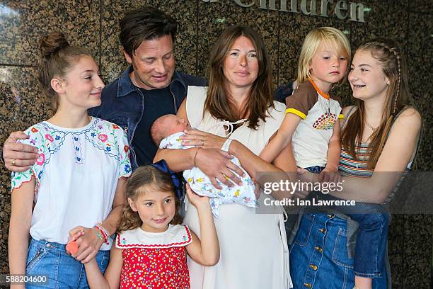 Jamie Oliver, Jools Oliver and their family pose with their new baby at The Portland Street Hospital on August 8, 2016 in London, England.